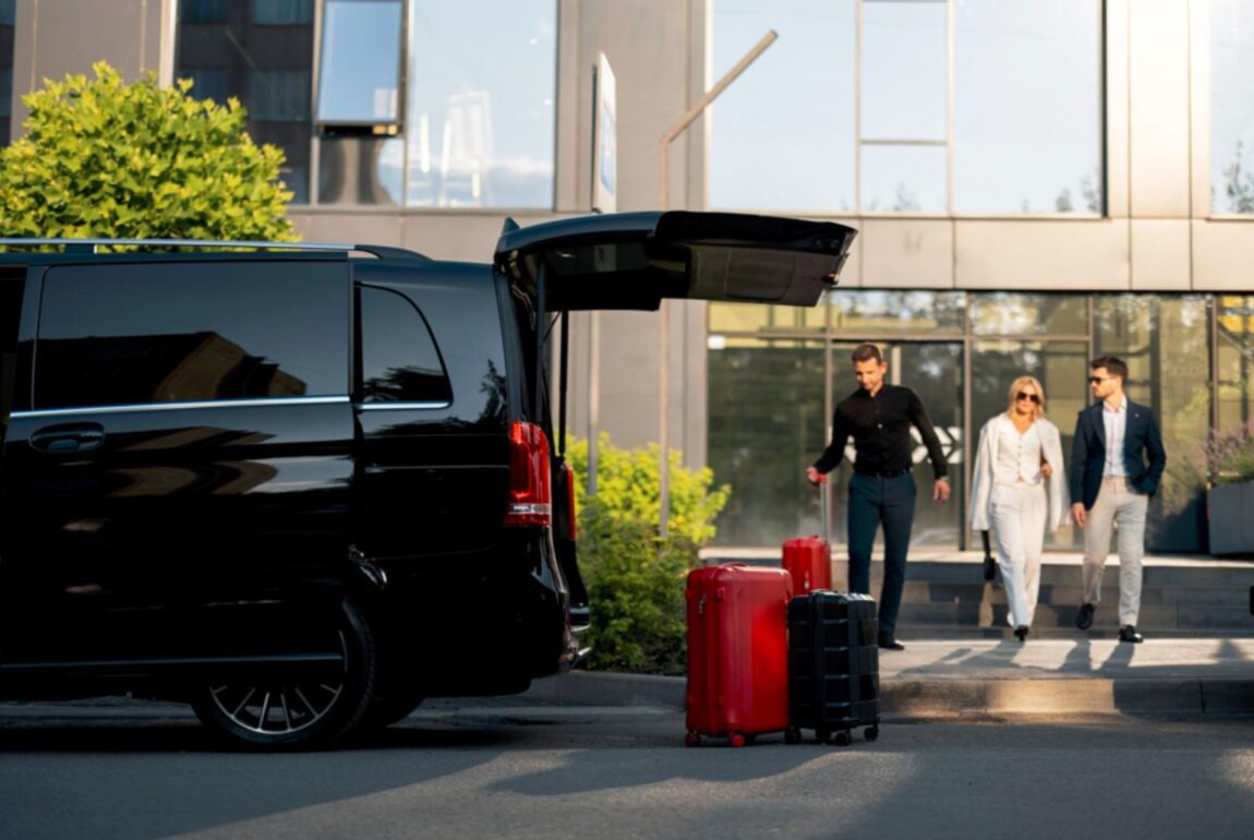 Chauffeur greeting clients with luggage