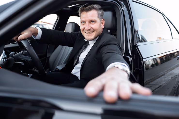 Professional chauffeur driving luxury sedan for airport transfers in Silver Spring MD