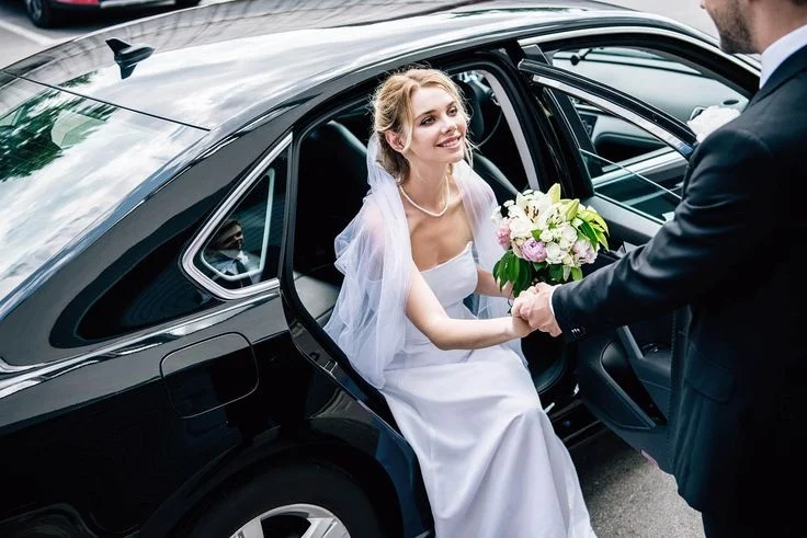 How Do Wedding Chauffeurs Handle Dress & Bouquet Care?