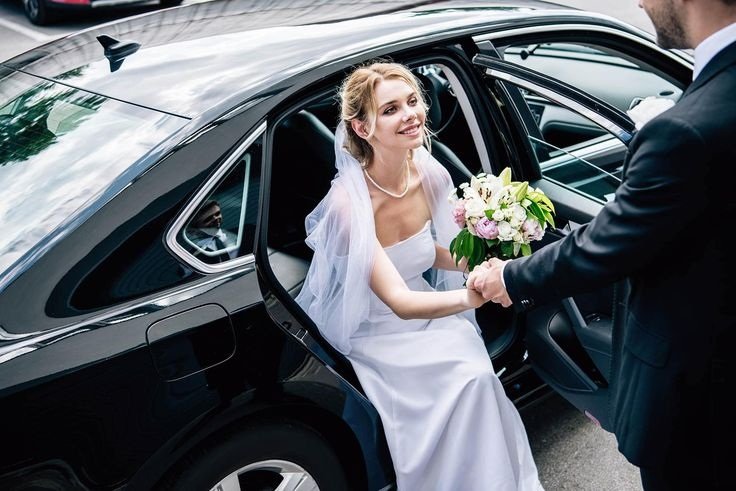 How Do Wedding Chauffeurs Handle Dress & Bouquet Care?